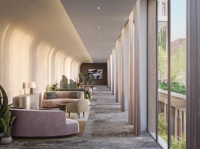 a roof deck with couches and potted plants