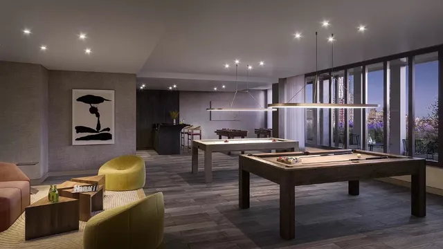 a view of a workspace with furniture and bathroom floor