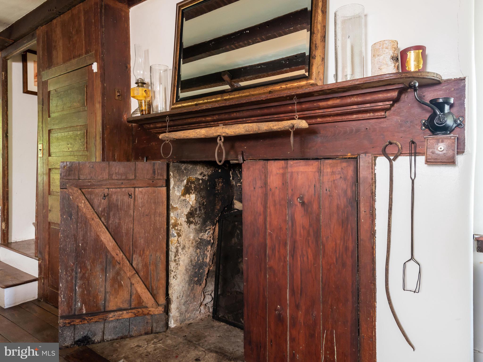 187 Iron Bridge Road Glenmoore, PA 19343 - Photo 17 of 58 Old fireplace w/rustic mantle & wood shutter doors