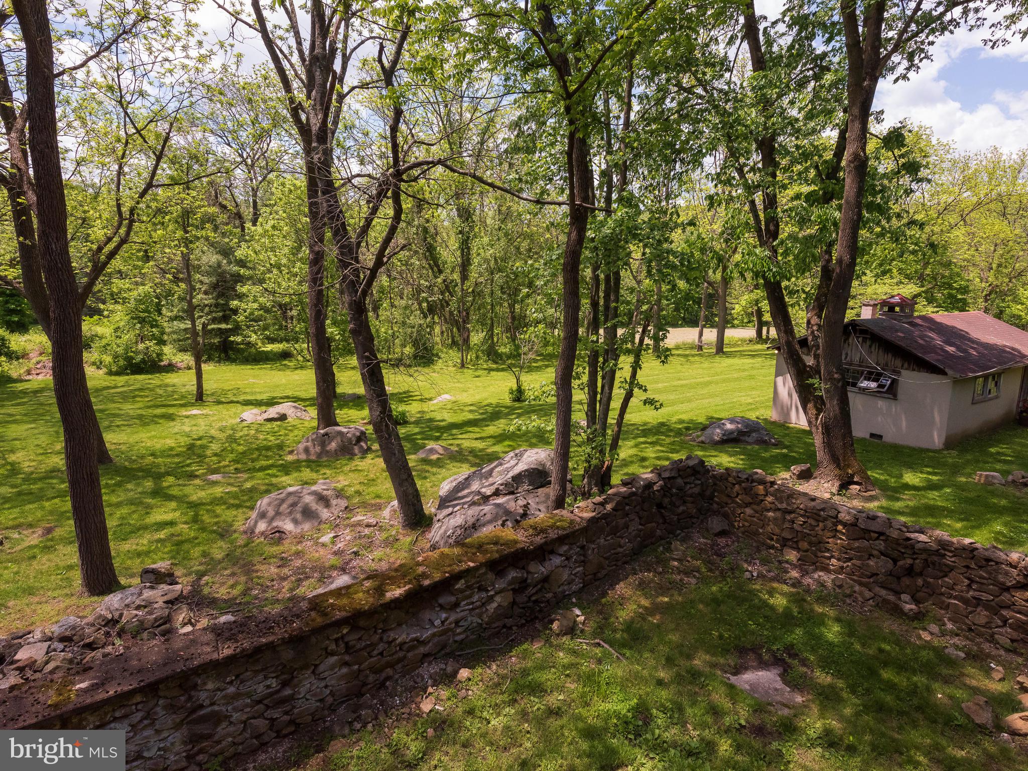 187 Iron Bridge Road Glenmoore, PA 19343 - Photo 36 of 58 Stone walls off lower level of Barn