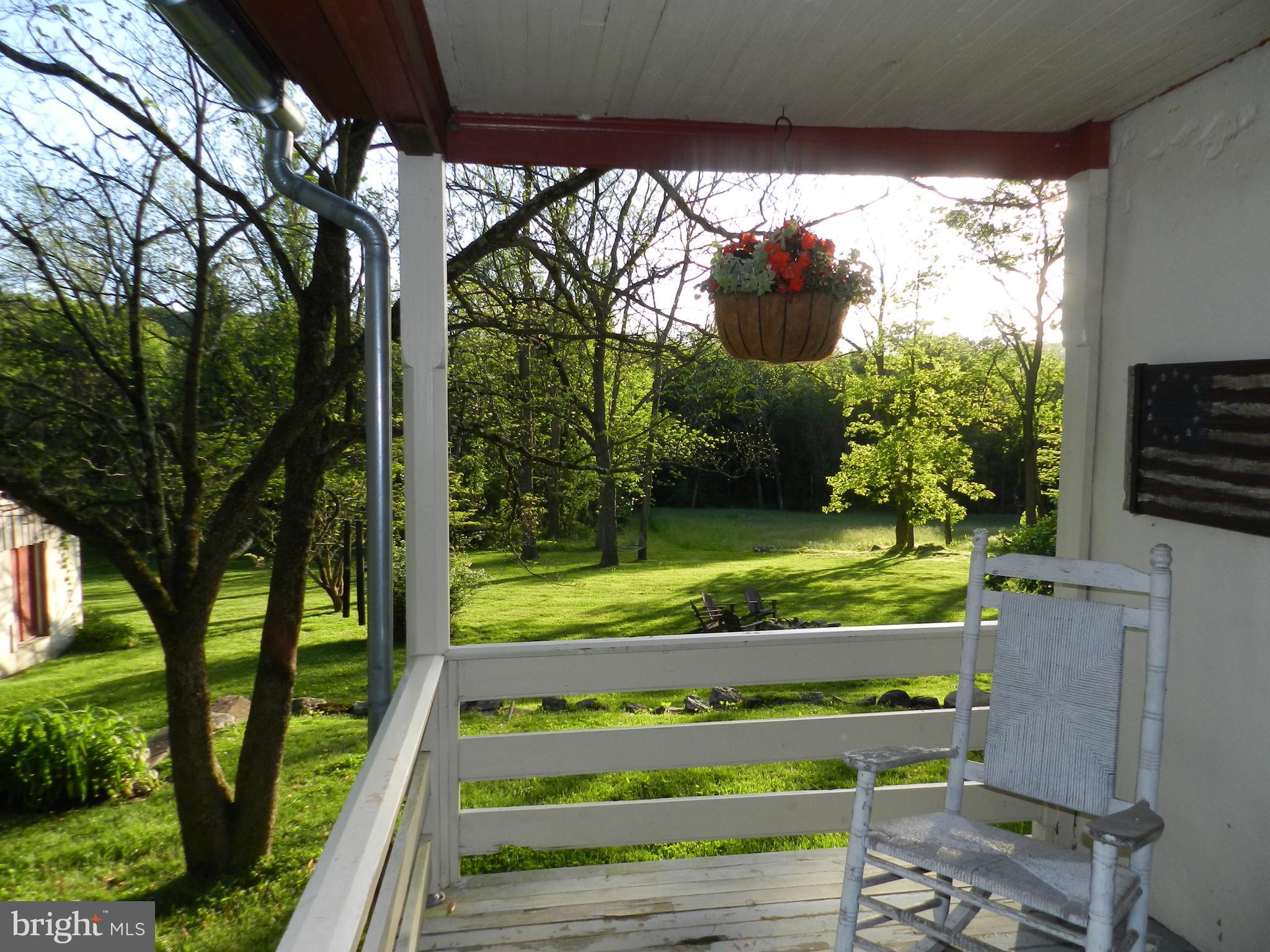 187 Iron Bridge Road Glenmoore, PA 19343 - Photo 46 of 58 Sunset views from Porch rocker
