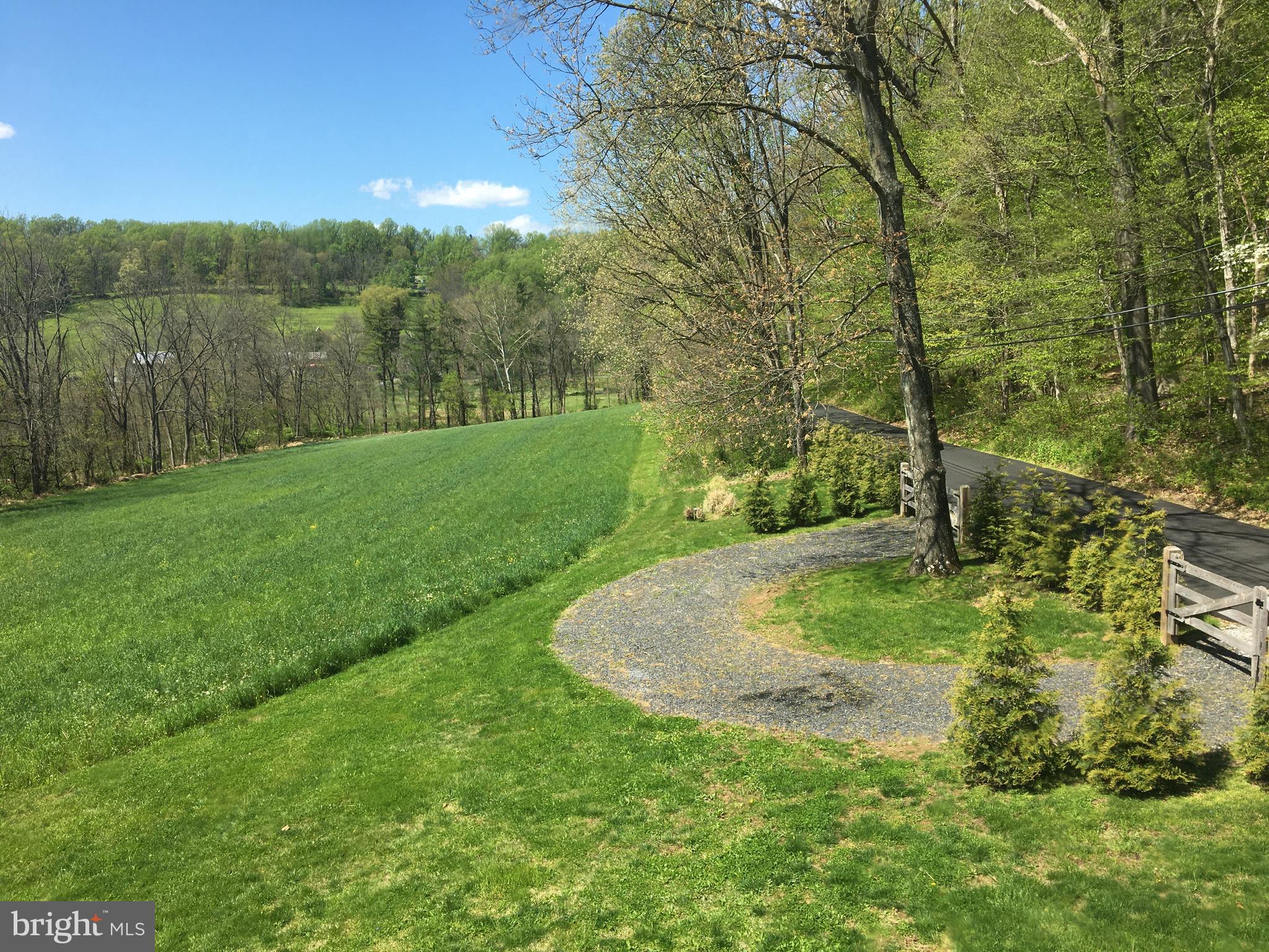 187 Iron Bridge Road Glenmoore, PA 19343 - Photo 57 of 58 Spring- longer views & hay is starting to grow