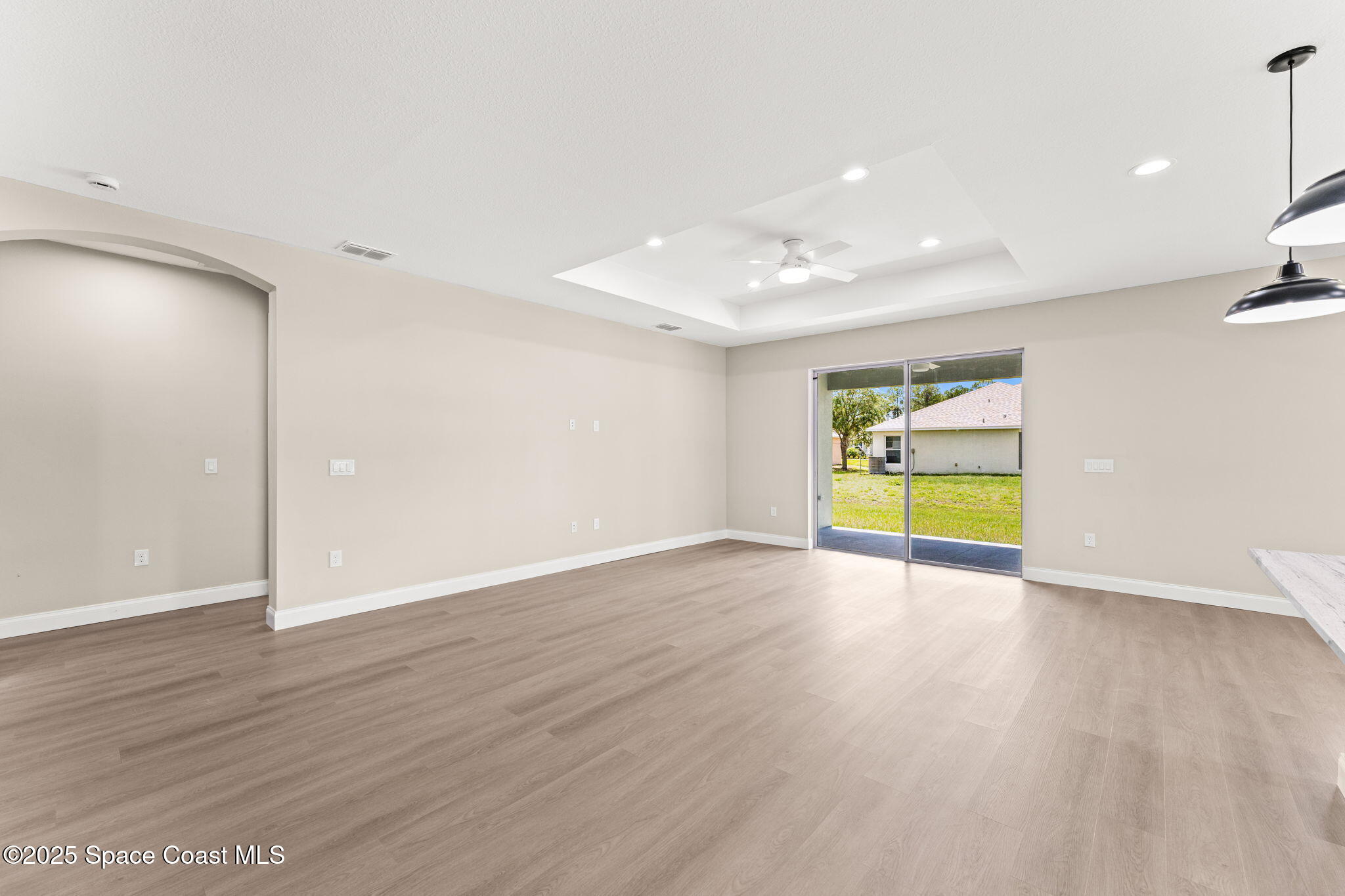241 Sarah Road Southwest Palm Bay, FL 32908 - Photo 11 of 54 a view of an empty room with wooden floor and a sink