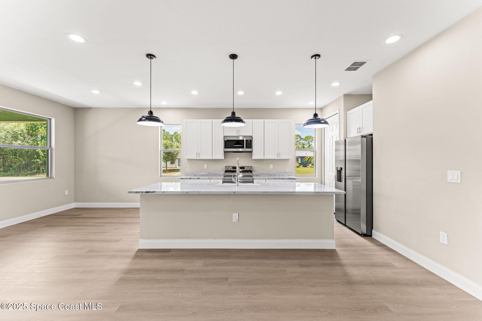 241 Sarah Road Southwest Palm Bay, FL 32908 - Photo 16 of 54 a view of kitchen with stainless steel appliances granite countertop cabinets and wide window