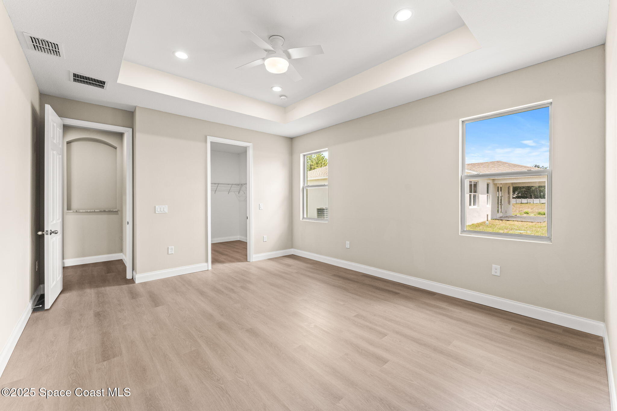 241 Sarah Road Southwest Palm Bay, FL 32908 - Photo 25 of 54 an empty room with windows and closet
