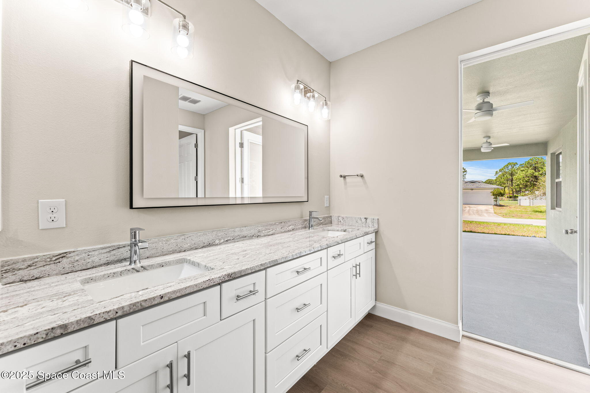 241 Sarah Road Southwest Palm Bay, FL 32908 - Photo 28 of 54 a bathroom with a granite countertop sink mirror and