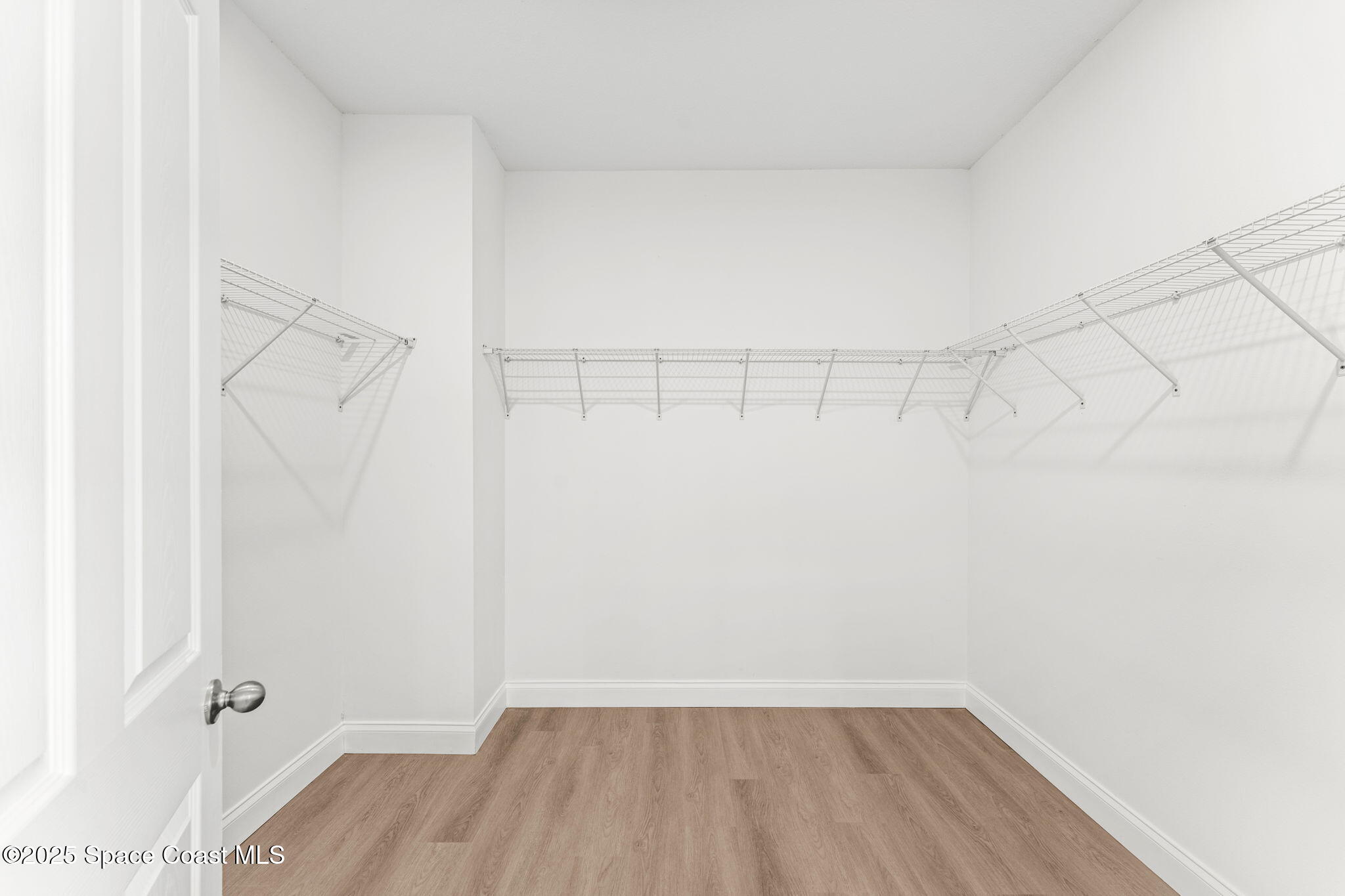 241 Sarah Road Southwest Palm Bay, FL 32908 - Photo 29 of 54 a view of a room with racks on the wall