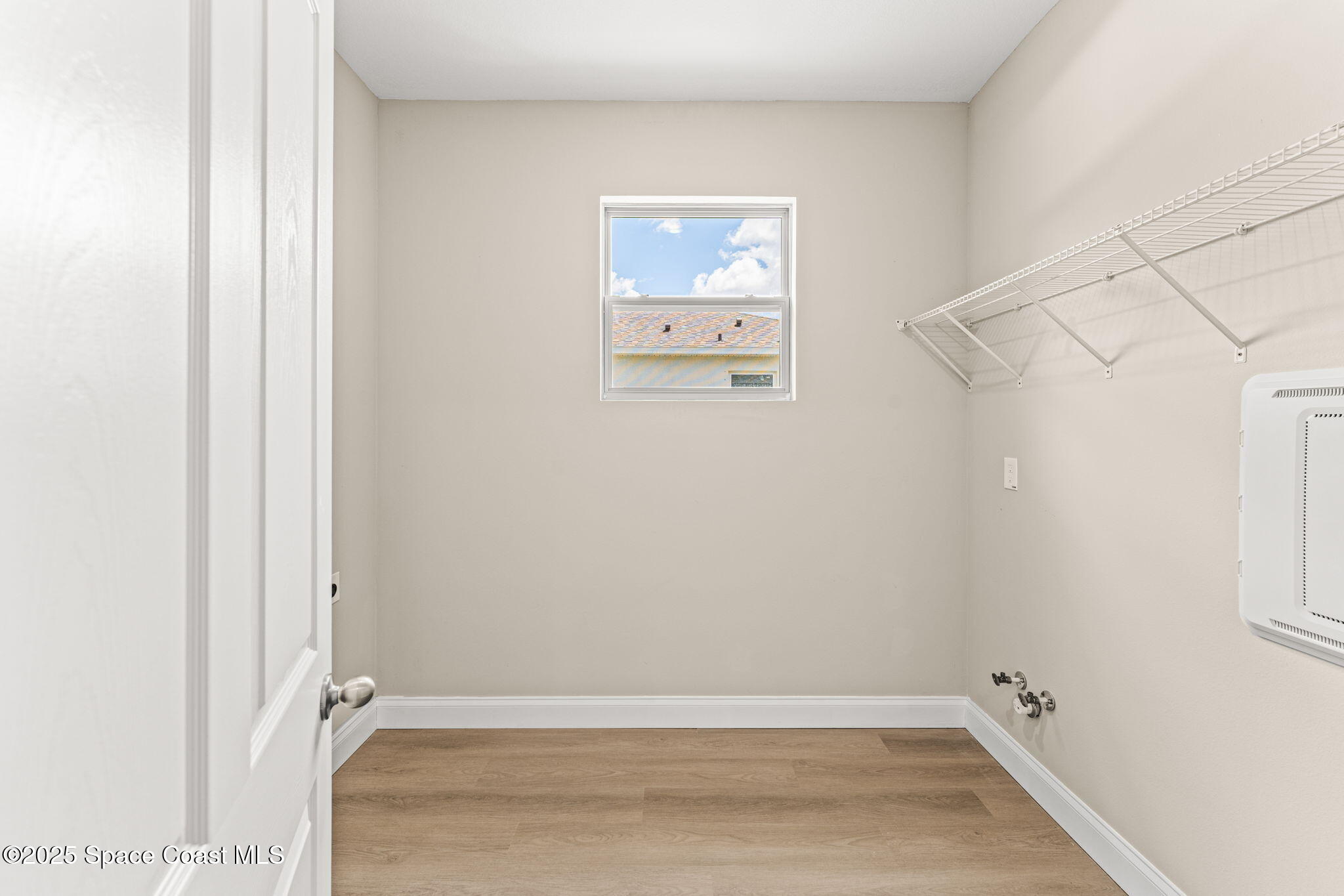 241 Sarah Road Southwest Palm Bay, FL 32908 - Photo 33 of 54 a view of room with racks on the wall