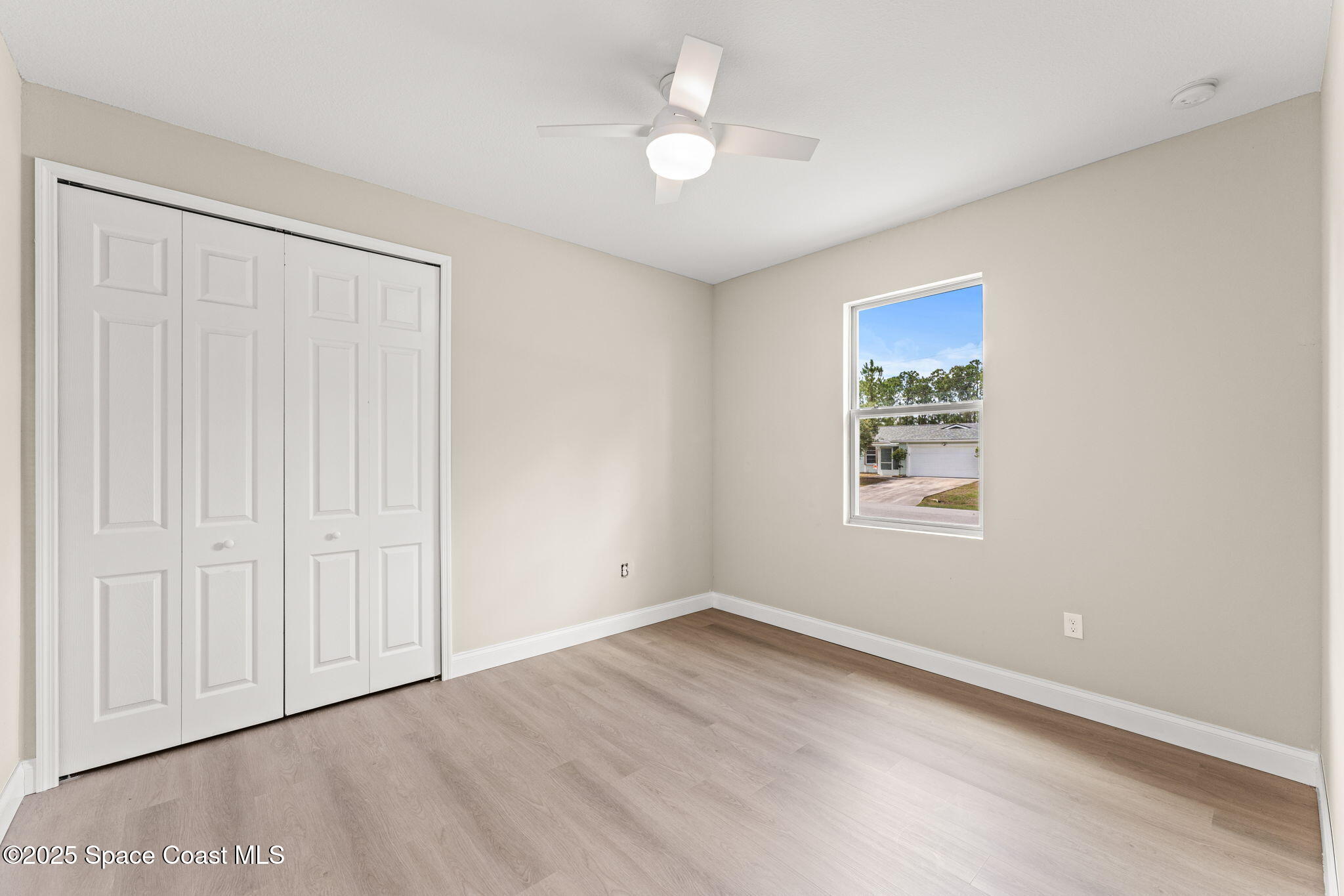 241 Sarah Road Southwest Palm Bay, FL 32908 - Photo 35 of 54 an empty room with a window