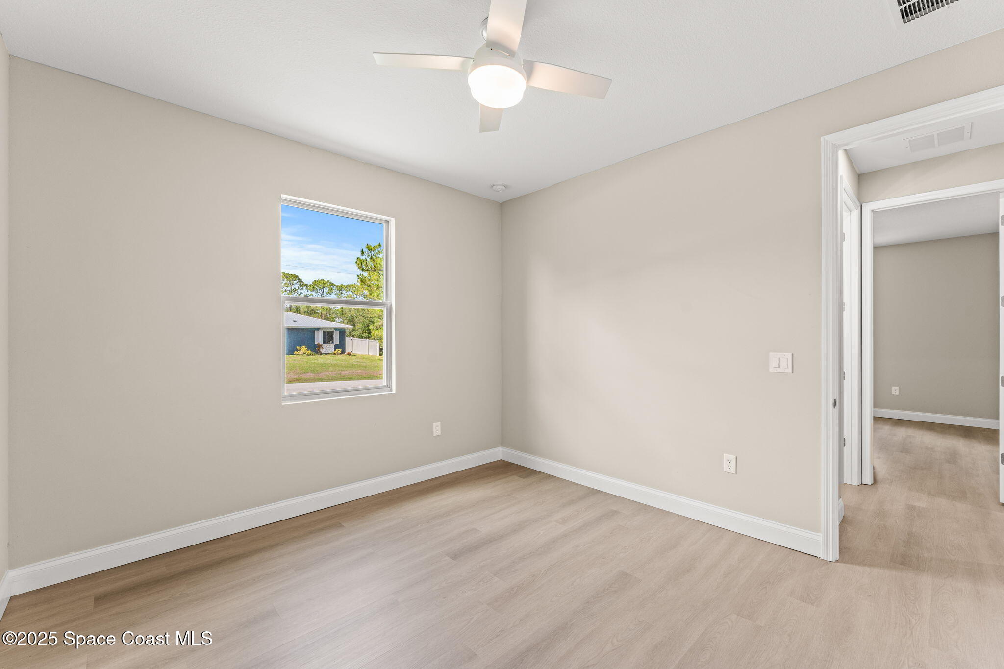 241 Sarah Road Southwest Palm Bay, FL 32908 - Photo 36 of 54 an empty room with a window and closet