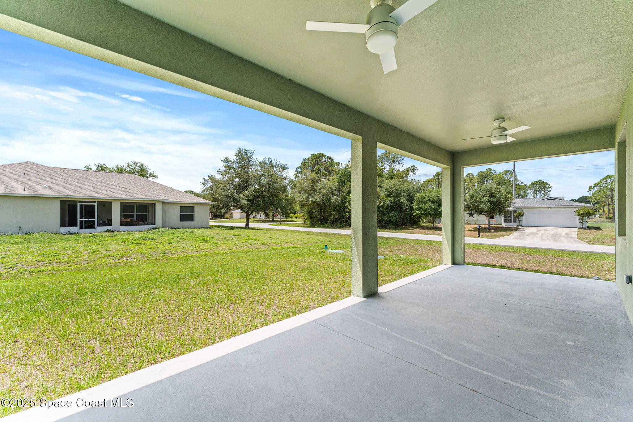 241 Sarah Road Southwest Palm Bay, FL 32908 - Photo 41 of 54 a house with swimming pool in front of it
