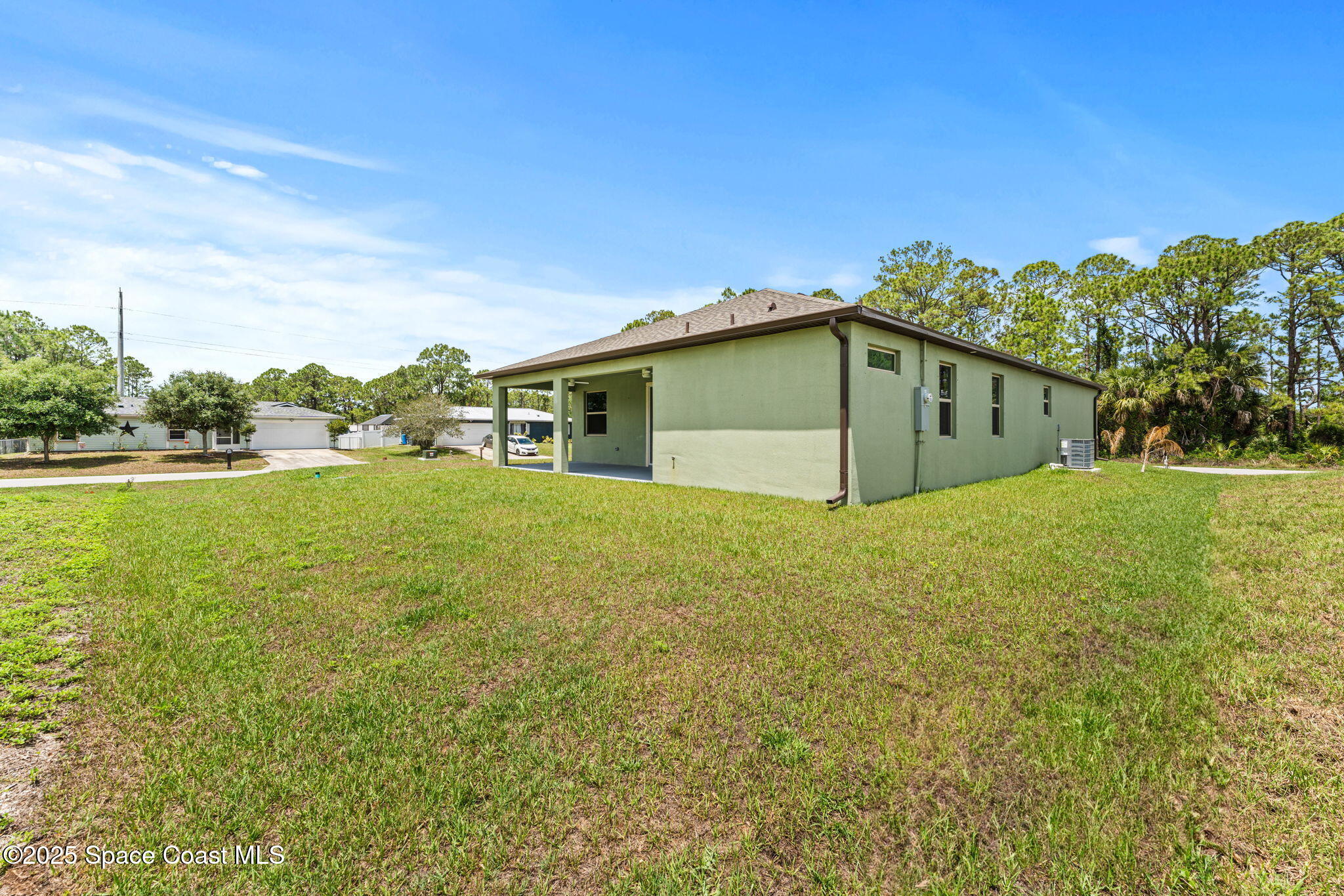 241 Sarah Road Southwest Palm Bay, FL 32908 - Photo 42 of 54 a view of a house with a yard