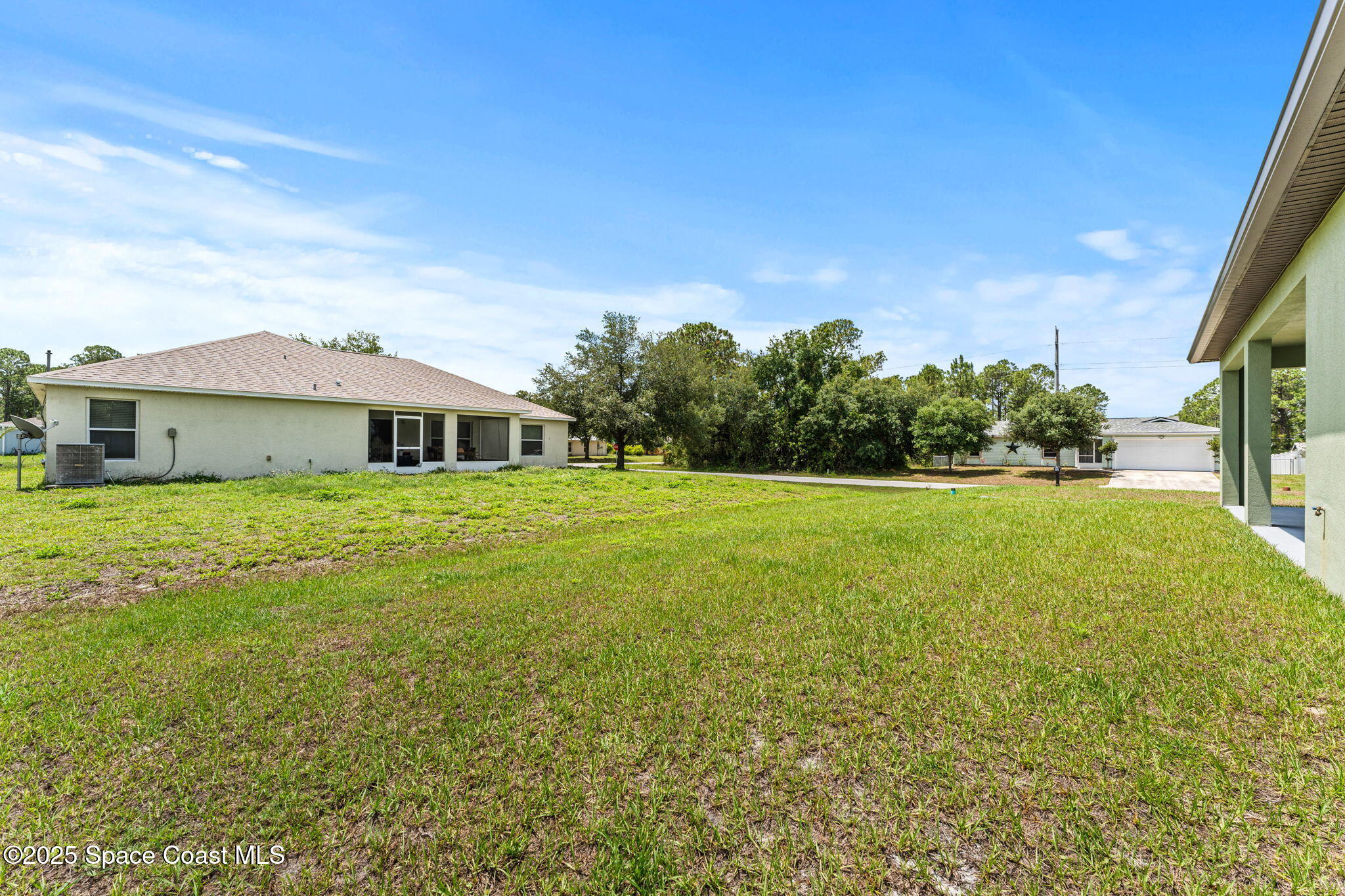 241 Sarah Road Southwest Palm Bay, FL 32908 - Photo 45 of 54 a front view of a house with a yard