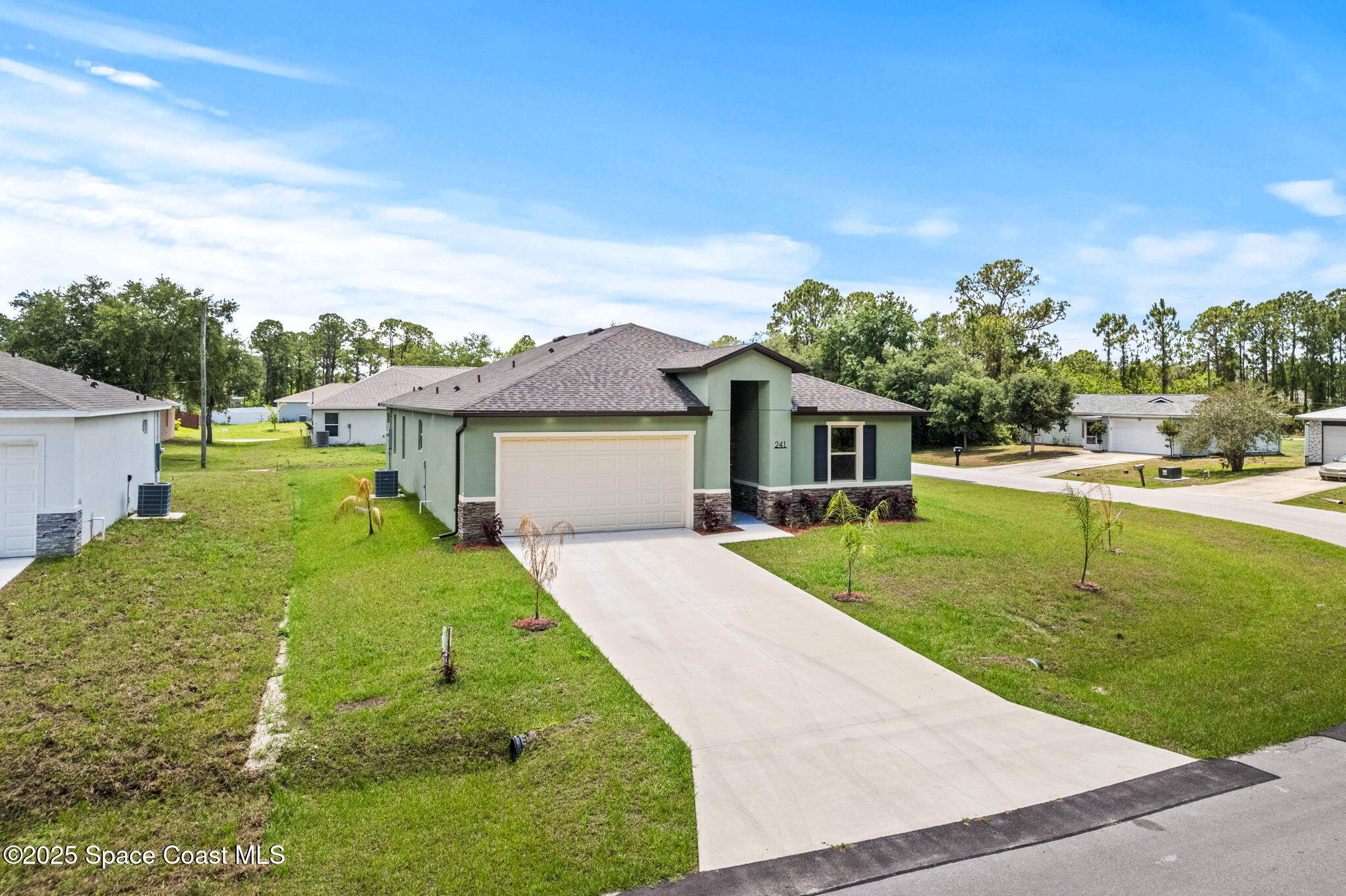 241 Sarah Road Southwest Palm Bay, FL 32908 - Photo 47 of 54 a front view of a house with garden
