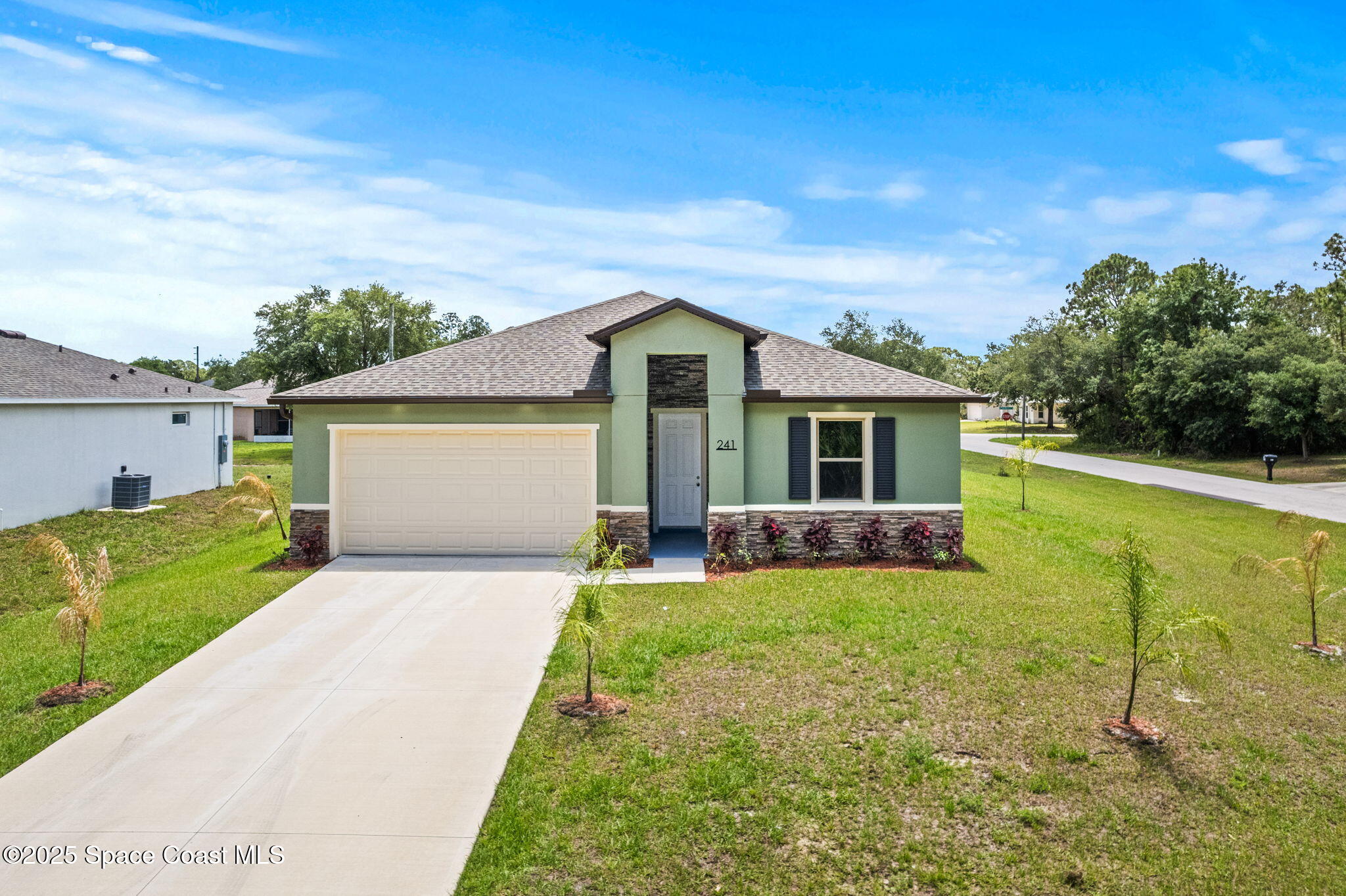 241 Sarah Road Southwest Palm Bay, FL 32908 - Photo 48 of 54 a front view of house with yard and green space
