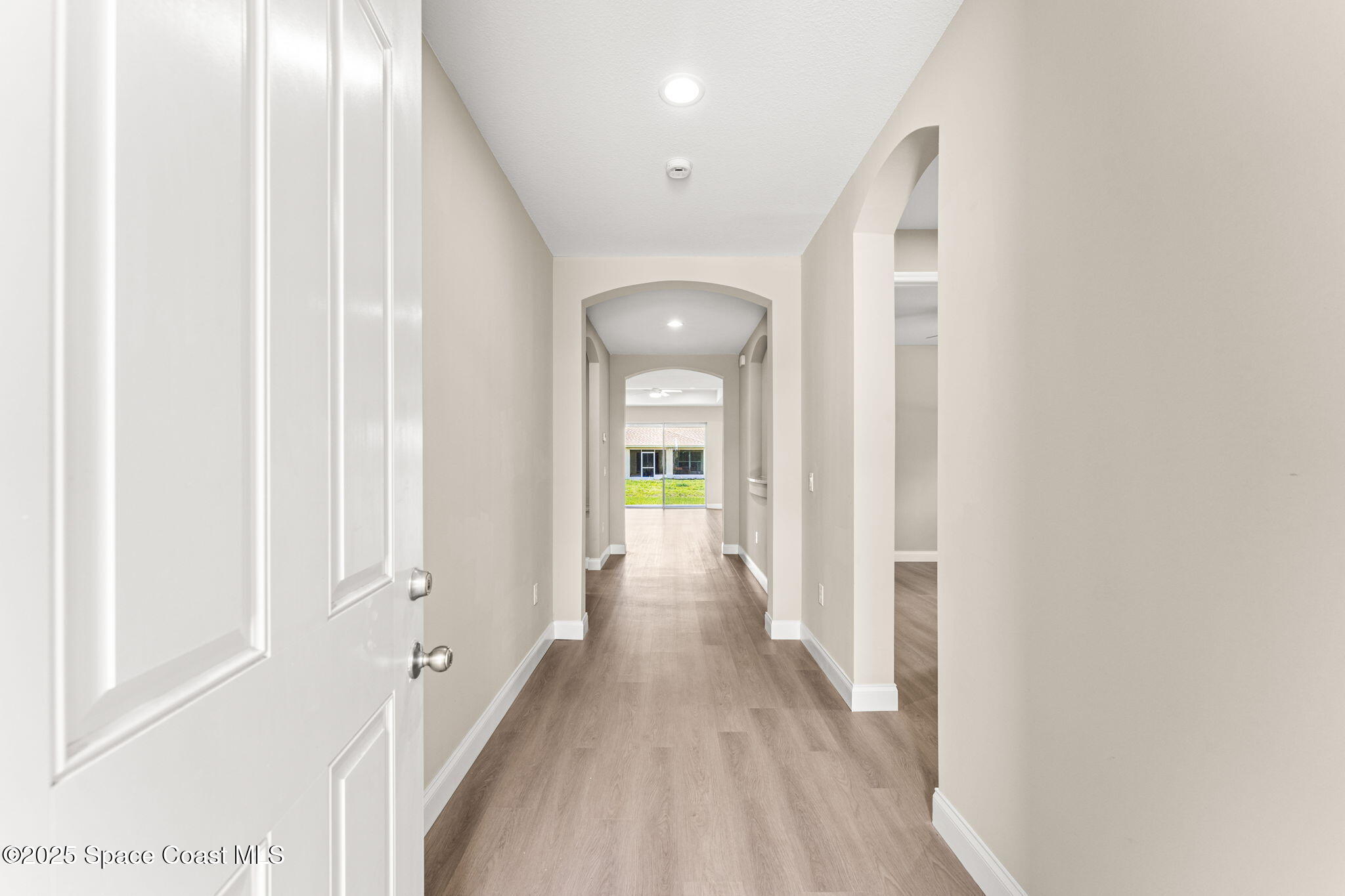 241 Sarah Road Southwest Palm Bay, FL 32908 - Photo 6 of 54 a view of a hallway with wooden floor