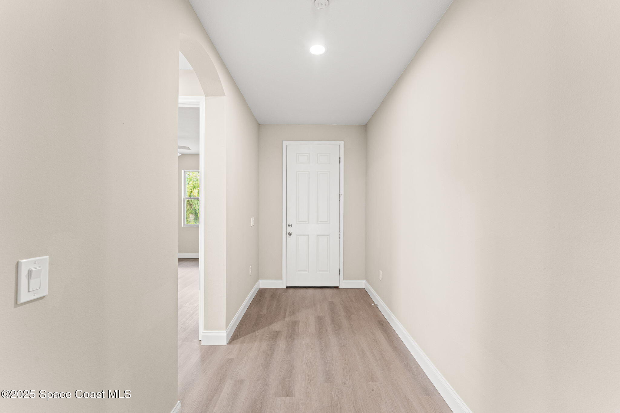 241 Sarah Road Southwest Palm Bay, FL 32908 - Photo 7 of 54 a view of a hallway with wooden floor