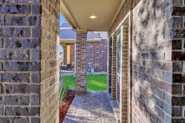 a view of a brick buildings with brick walls