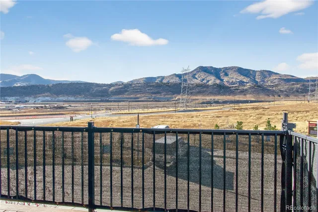 a view of swimming pool with a dinning table and chairs