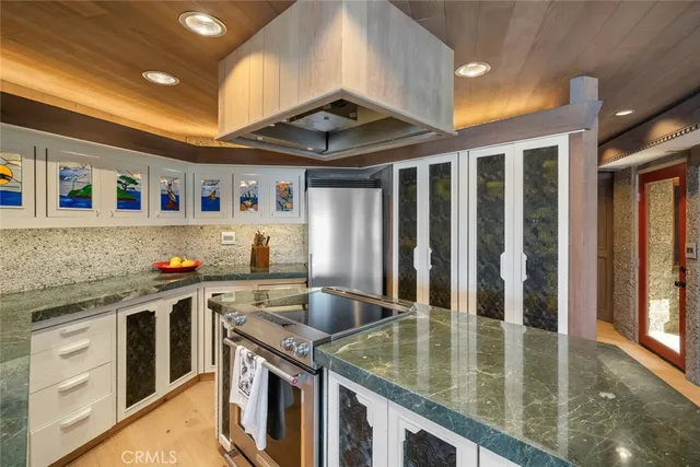 a room with lots of furniture and a large window