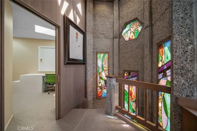 a lobby with furniture and potted plant