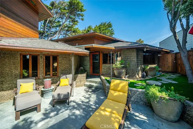 a view of house and tree in front of it