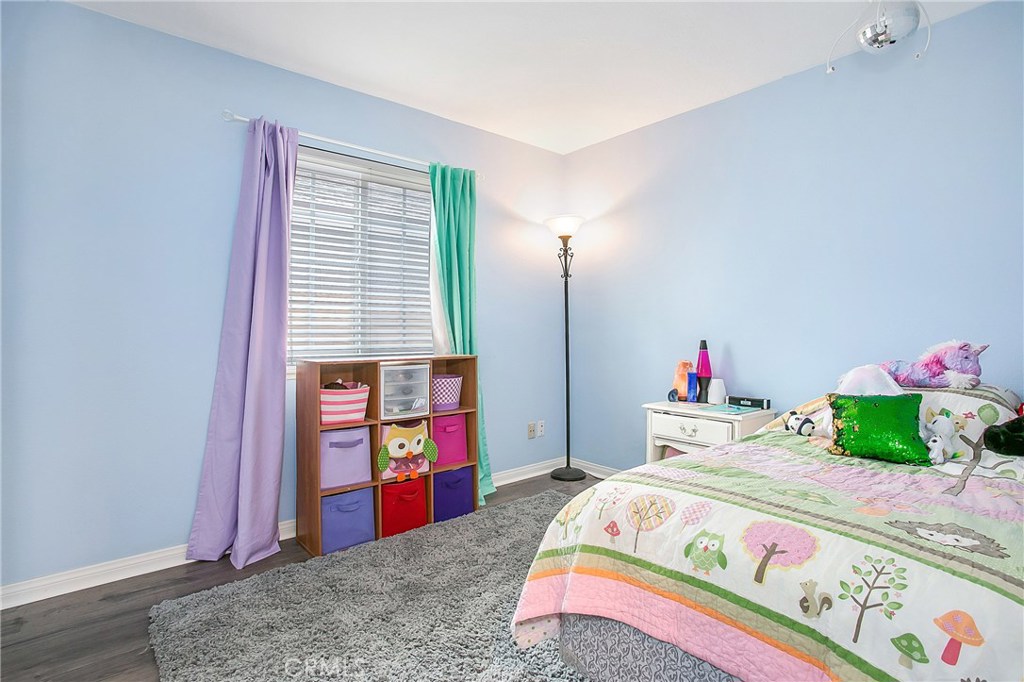 22876 Broadleaf Lake Forest, CA 92630 - Photo 13 of 26 a bedroom with a bed and a window