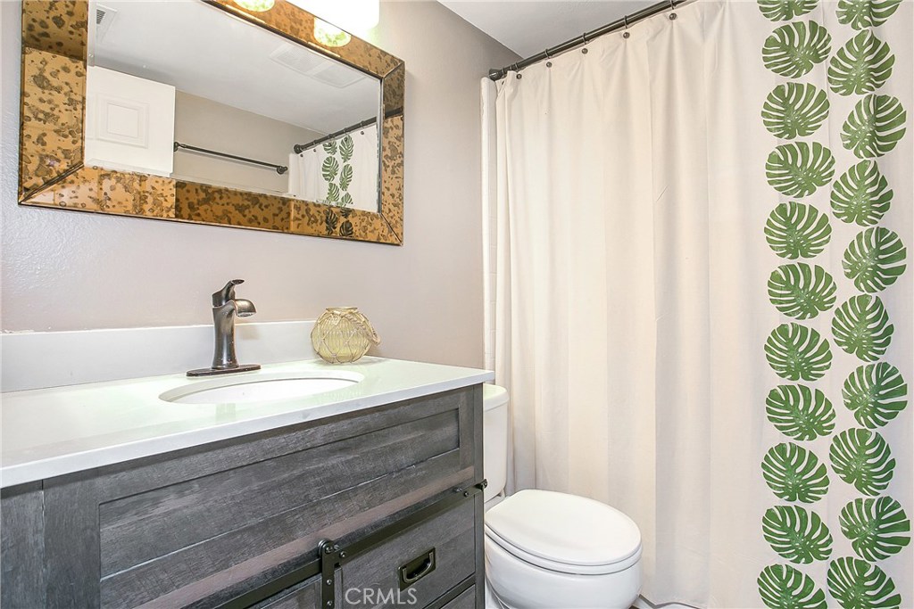 22876 Broadleaf Lake Forest, CA 92630 - Photo 14 of 26 a bathroom with a sink a toilet and a mirror
