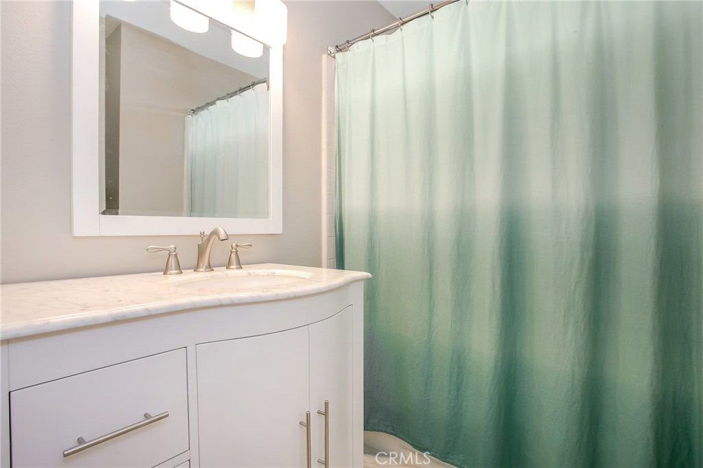 22876 Broadleaf Lake Forest, CA 92630 - Photo 15 of 26 a bathroom with a sink and a mirror
