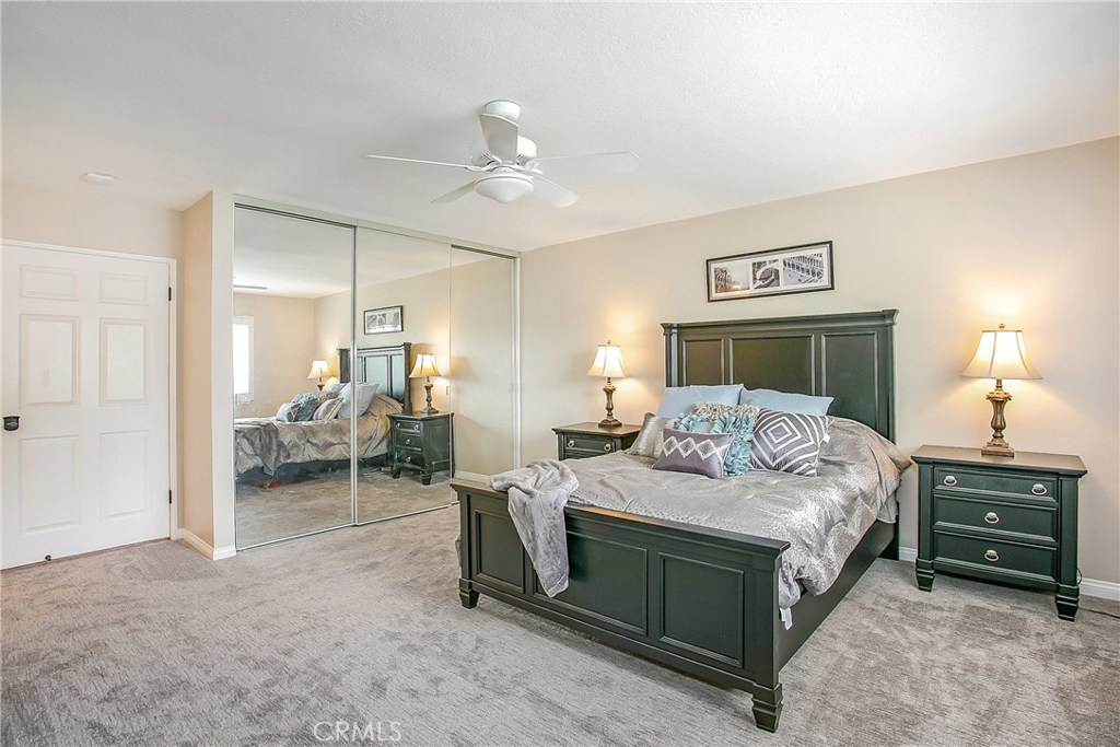 22876 Broadleaf Lake Forest, CA 92630 - Photo 18 of 26 a bedroom with a bed and a table in it