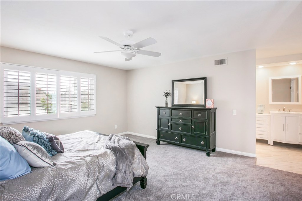 22876 Broadleaf Lake Forest, CA 92630 - Photo 19 of 26 a bedroom with a bed and a cabinets