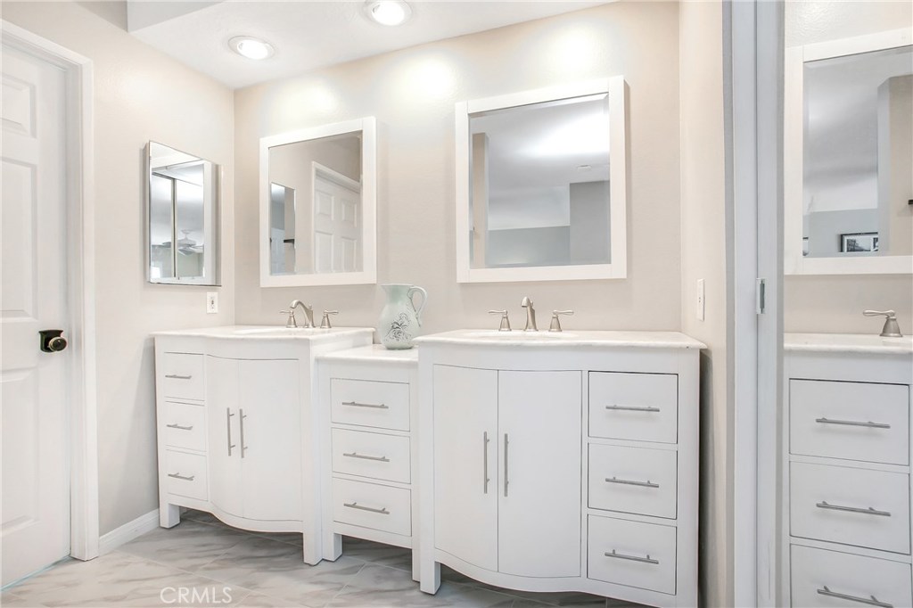22876 Broadleaf Lake Forest, CA 92630 - Photo 20 of 26 a bathroom with double vanity sink and a mirror