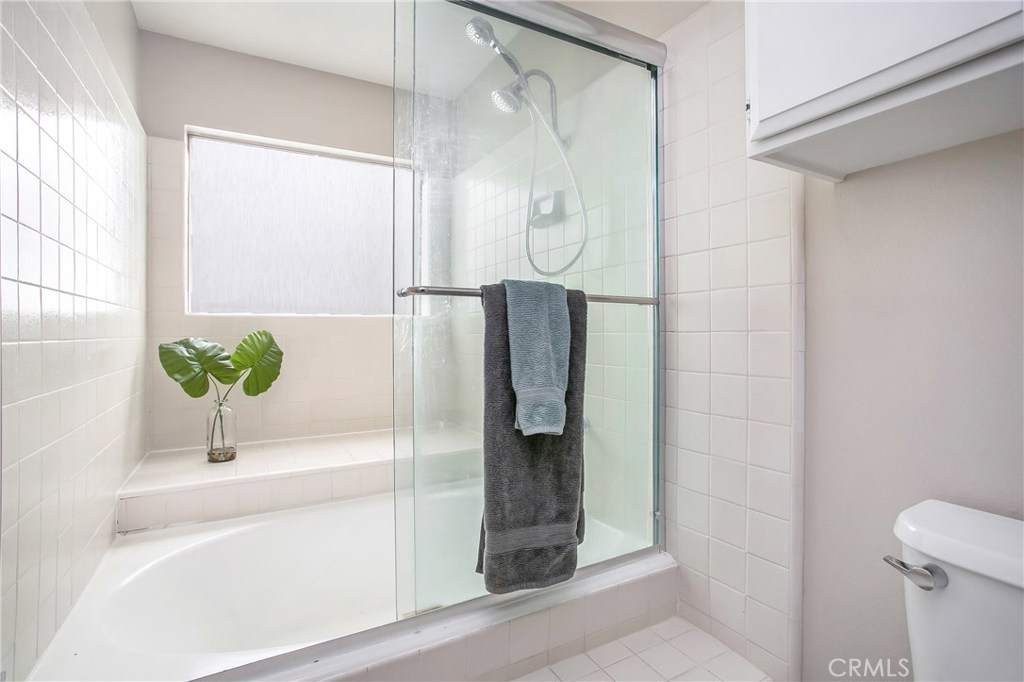 22876 Broadleaf Lake Forest, CA 92630 - Photo 21 of 26 a bathroom with a shower and a sink