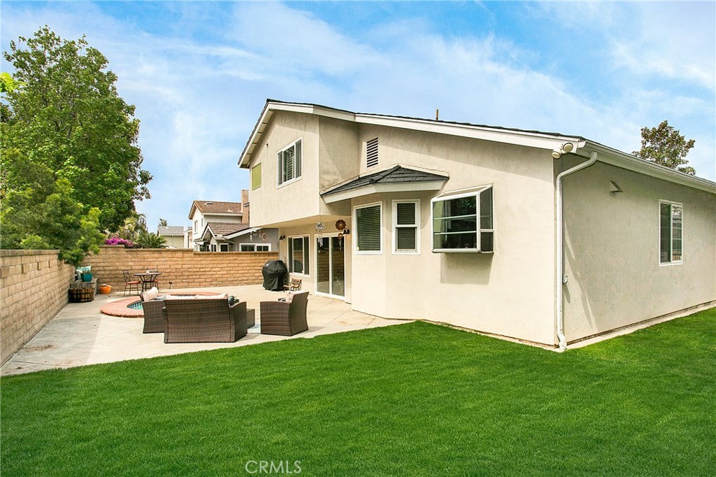 22876 Broadleaf Lake Forest, CA 92630 - Photo 22 of 26 a front view of a house with a garden and chairs