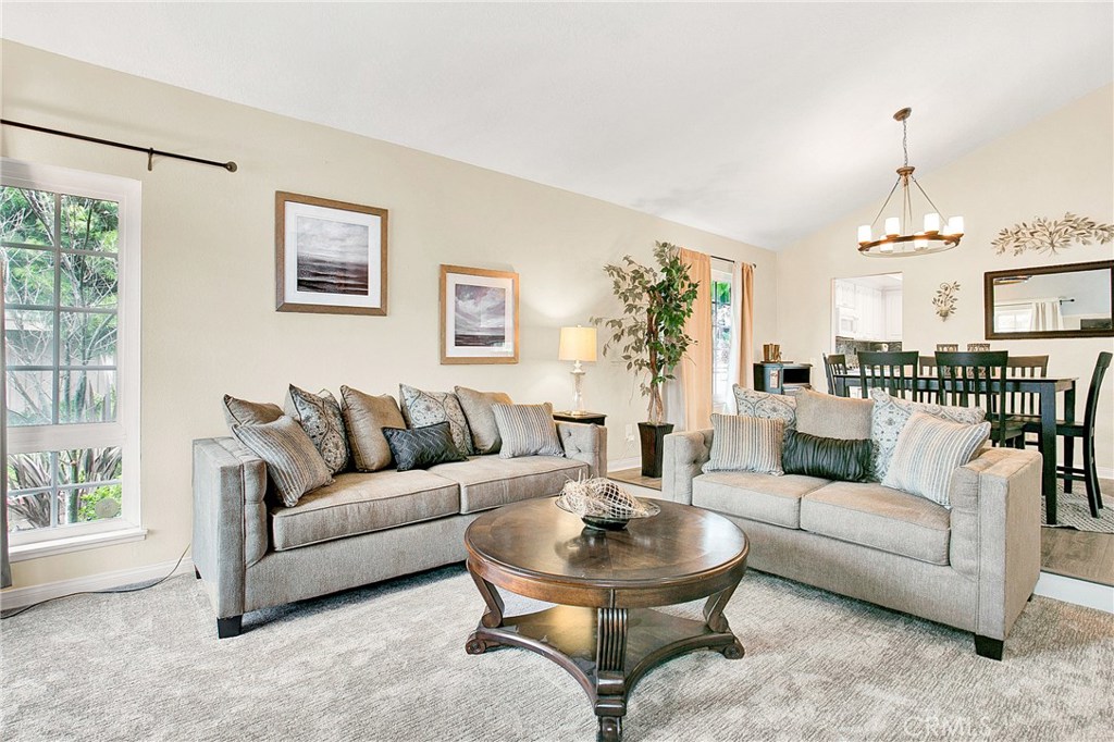 22876 Broadleaf Lake Forest, CA 92630 - Photo 4 of 26 a living room with furniture and a table