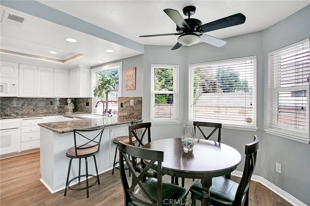 22876 Broadleaf Lake Forest, CA 92630 - Photo 6 of 26 a view of a a dining room with furniture window and wooden floor