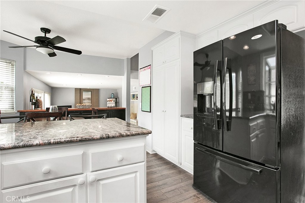 22876 Broadleaf Lake Forest, CA 92630 - Photo 9 of 26 a view of a bathroom with a granite countertop sink mirror and refrigerator