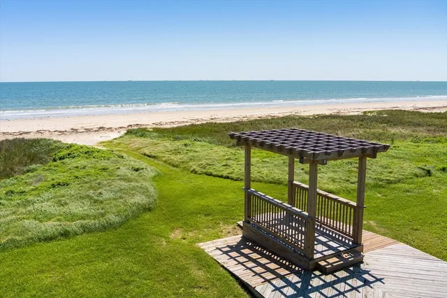 a view of a swimming pool with an ocean view
