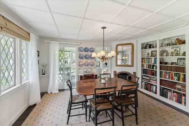 a view of a dining room with furniture and window