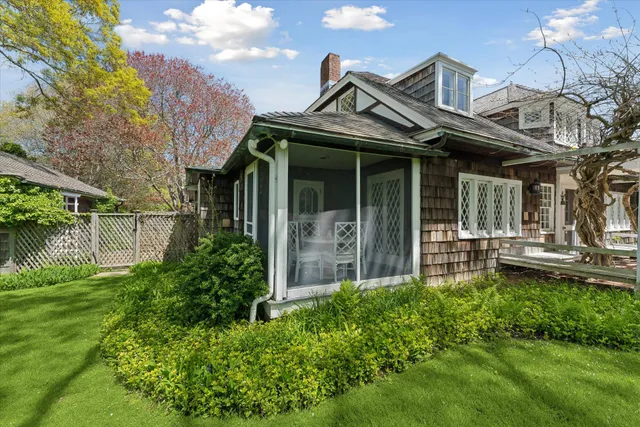 a view of a backyard with swimming pool