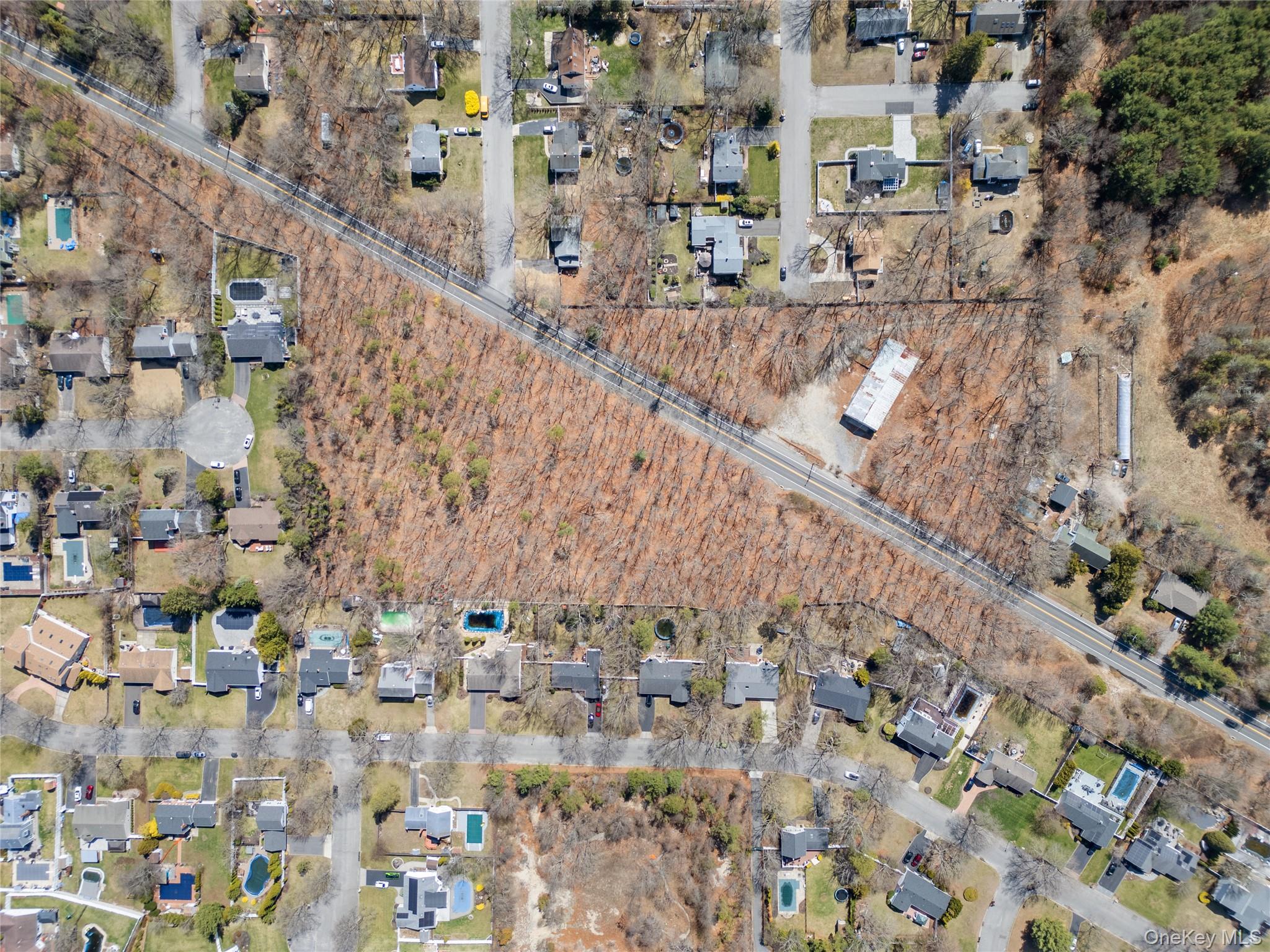 751 Canal Road Mount Sinai, NY 11766 - Photo 2 of 7 a view of entryway with wooden floor
