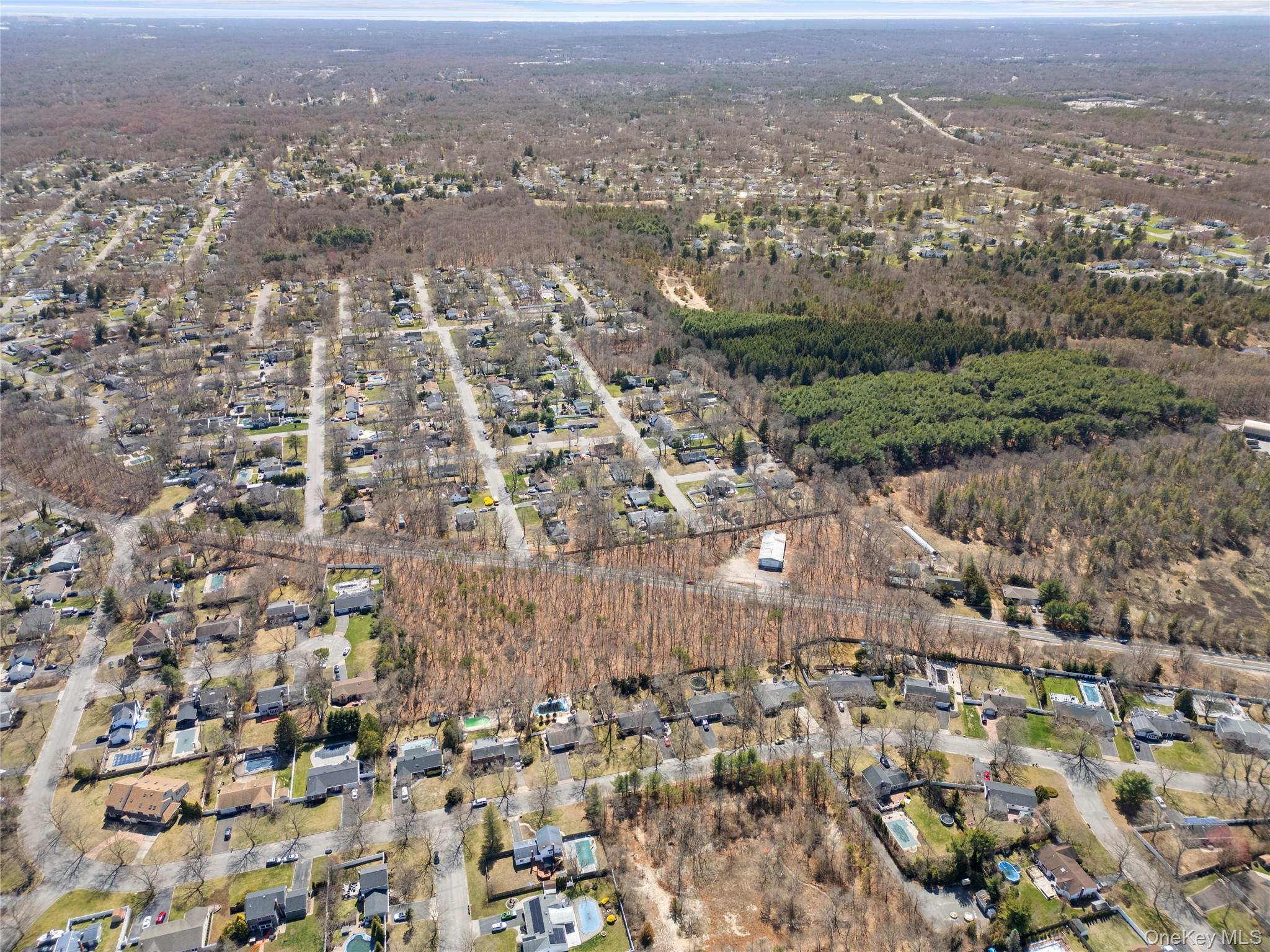 751 Canal Road Mount Sinai, NY 11766 - Photo 4 of 7 an aerial view of residential building with parking space