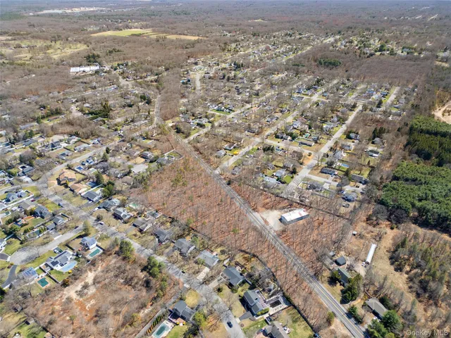 an aerial view of house with yard