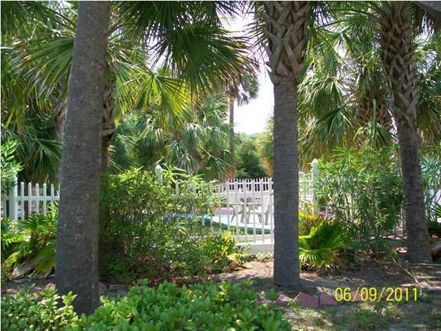 43 Miami Street Destin, FL 32550 - Photo 12 of 12 a sign that is sitting in front of a tree