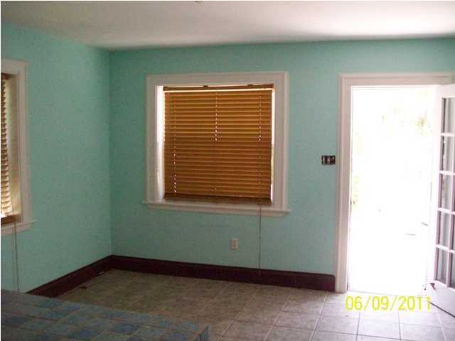 43 Miami Street Destin, FL 32550 - Photo 6 of 12 a view of an empty room with a window and a dresser