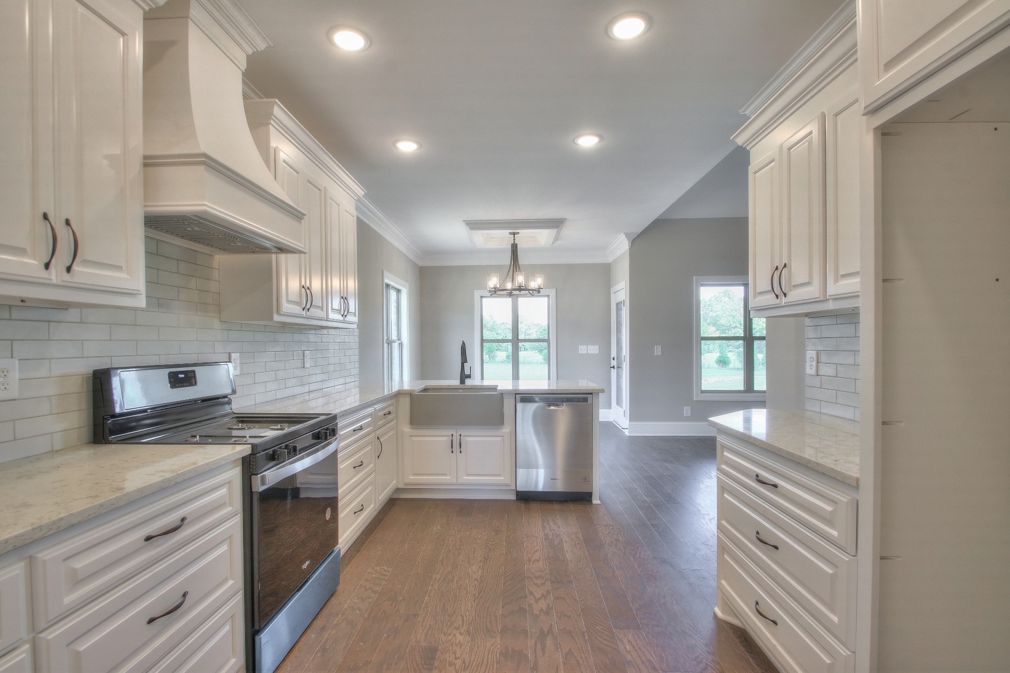 437 Burford Road Lebanon, TN 37087 - Photo 11 of 43 a kitchen with white cabinets and appliances