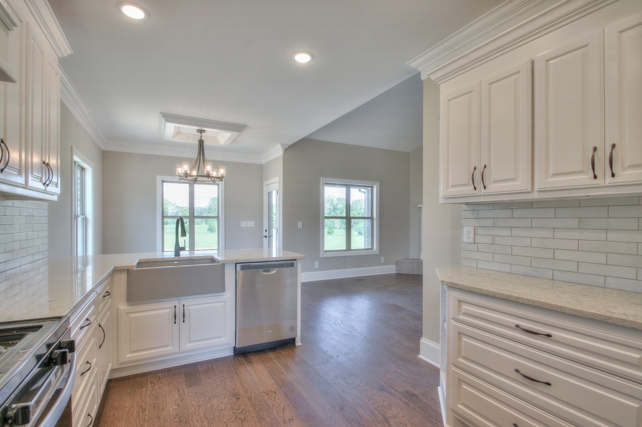437 Burford Road Lebanon, TN 37087 - Photo 12 of 43 a kitchen with granite countertop white cabinets and wooden floor