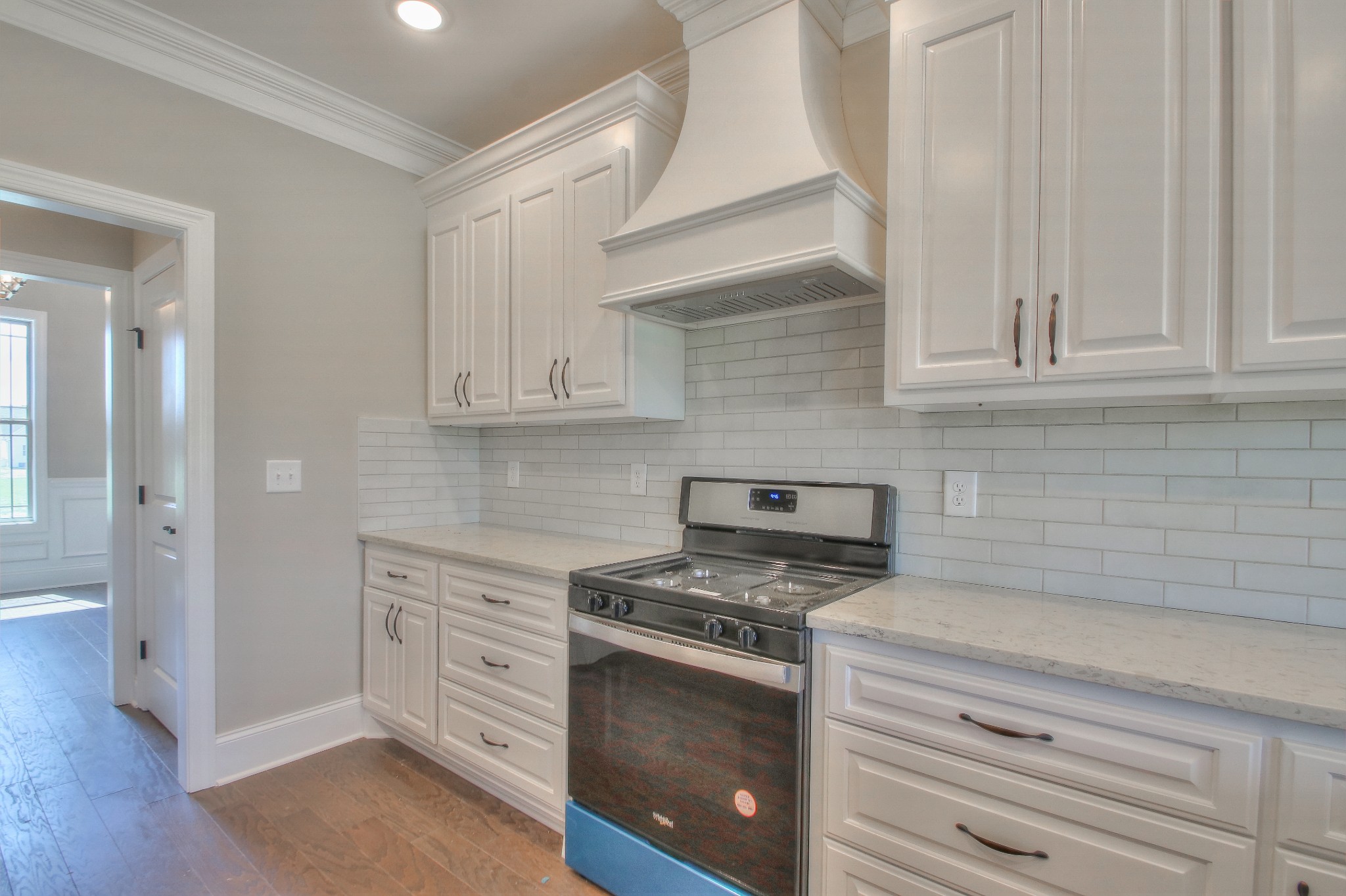 437 Burford Road Lebanon, TN 37087 - Photo 14 of 43 a kitchen with white cabinets and appliances