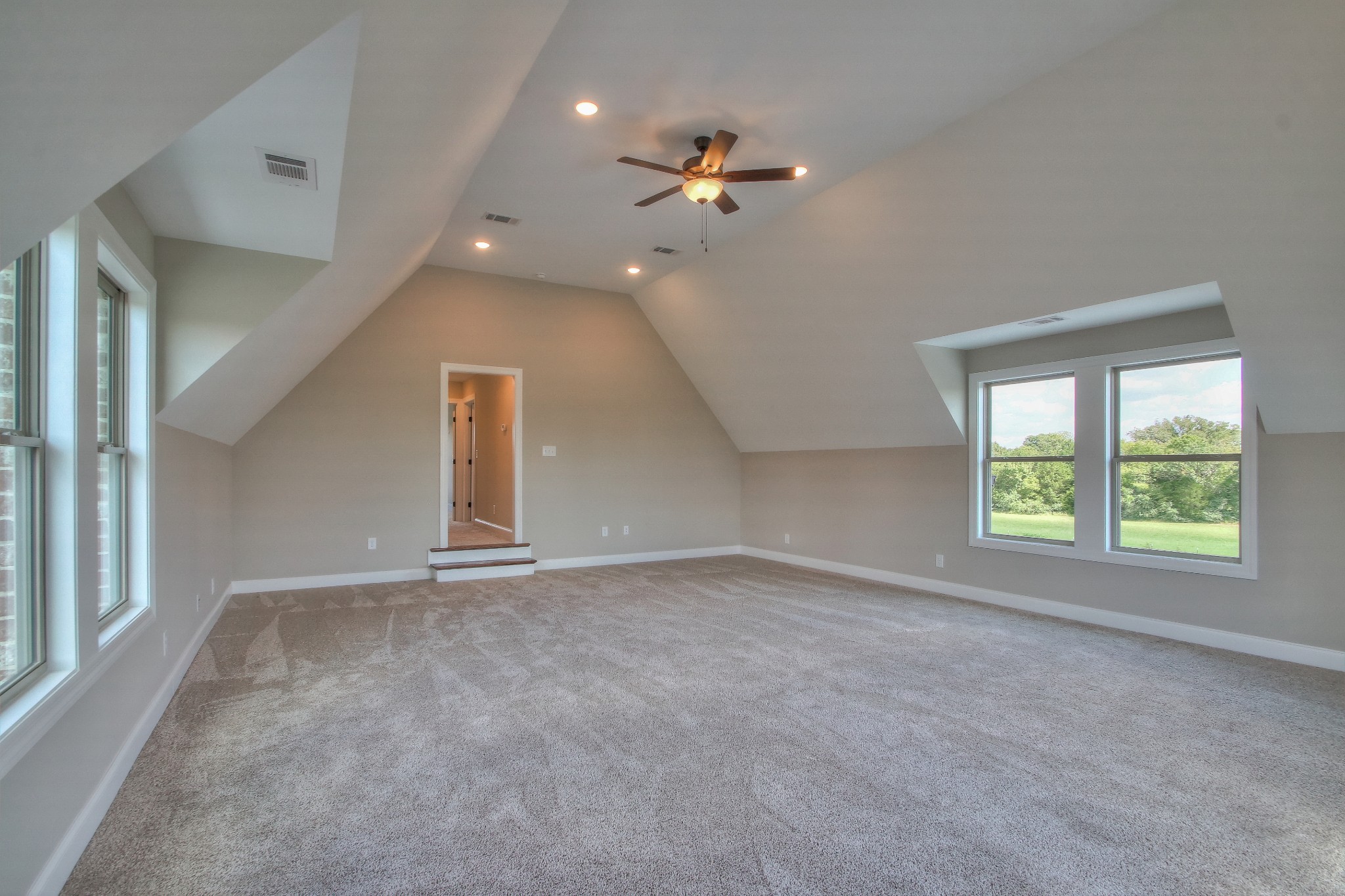 437 Burford Road Lebanon, TN 37087 - Photo 38 of 43 an empty room with windows and chandelier fan