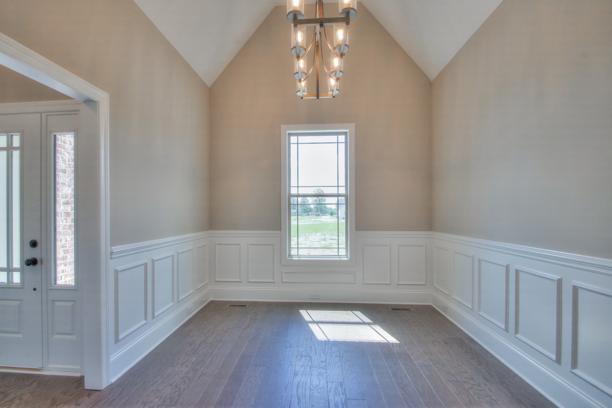 437 Burford Road Lebanon, TN 37087 - Photo 7 of 43 an empty room with wooden floor and windows